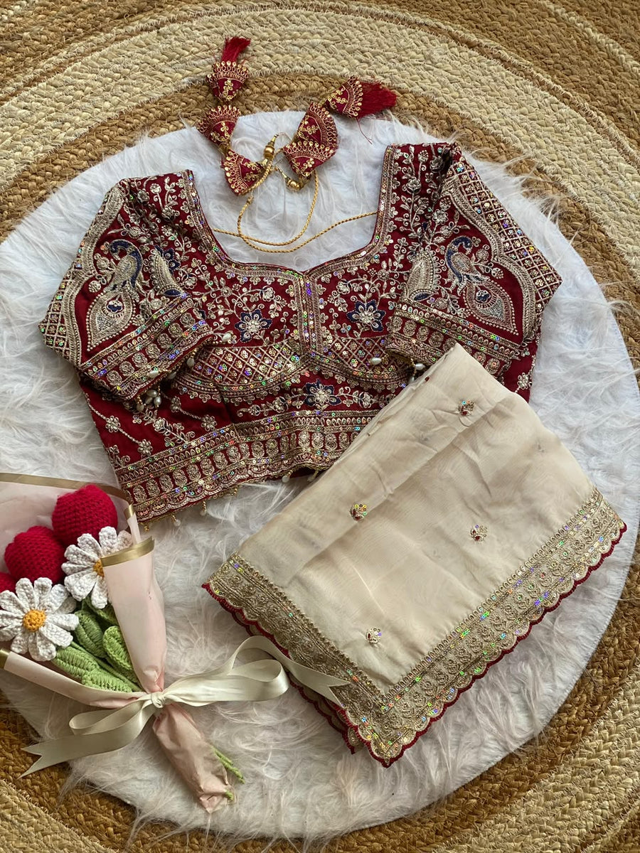 Ivory Rangoli Silk Saree with Embroidered Wine Blouse